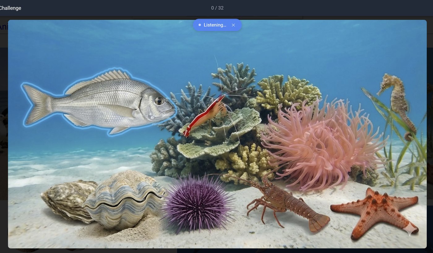 A coral reef with a fish highlighted, waiting for the learner to say its name.